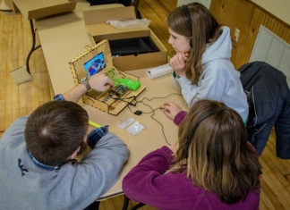 Students learn programming in the classroom through WVU extension programs.