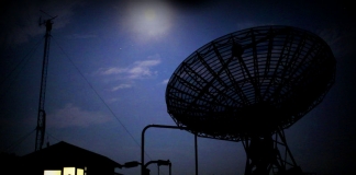 A student stands in the doorway of the control room for the 40-foot Telescope at the Green Bank Observatory.