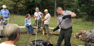 A park ranger demonstrates fire-pit cooking at North Bend State Park near Cairo, West Virginia