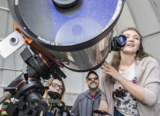 Professor Kathryn Williamson and students use the 14-inch telescope at White Hall.