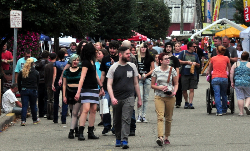 Fans of the Mothman wander Main Street during the Mothman Festival at Point Pleasant, West Virginia.