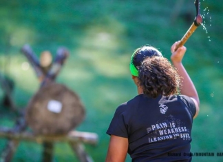 A competitor throws a tomahawk during the annual Mountain Games competition at Heritage Farms near Huntington, West Virginia.