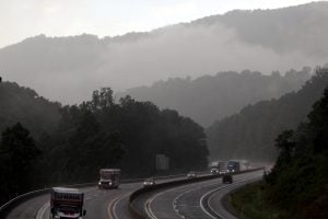 Vision impairment: Motorists navigate the West Virginia Turnpike in Fayette County during a summer downpour.