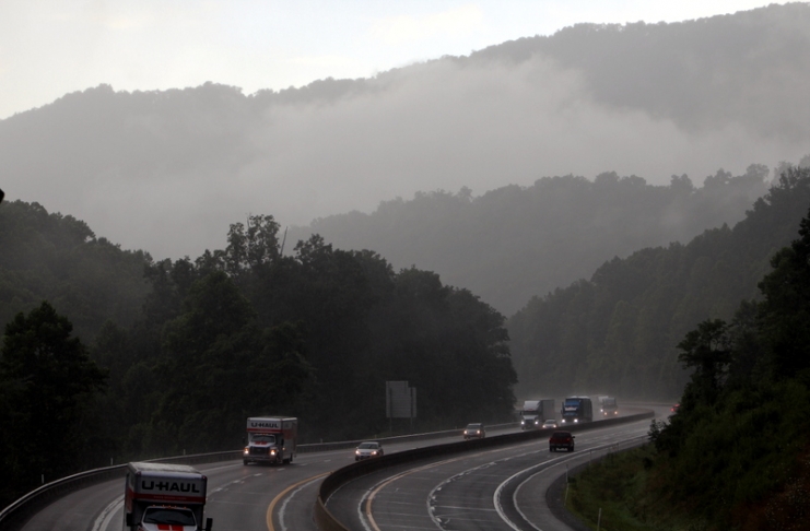 Motorists navigate the West Virginia Turnpike in Fayette County during a summer downpour.