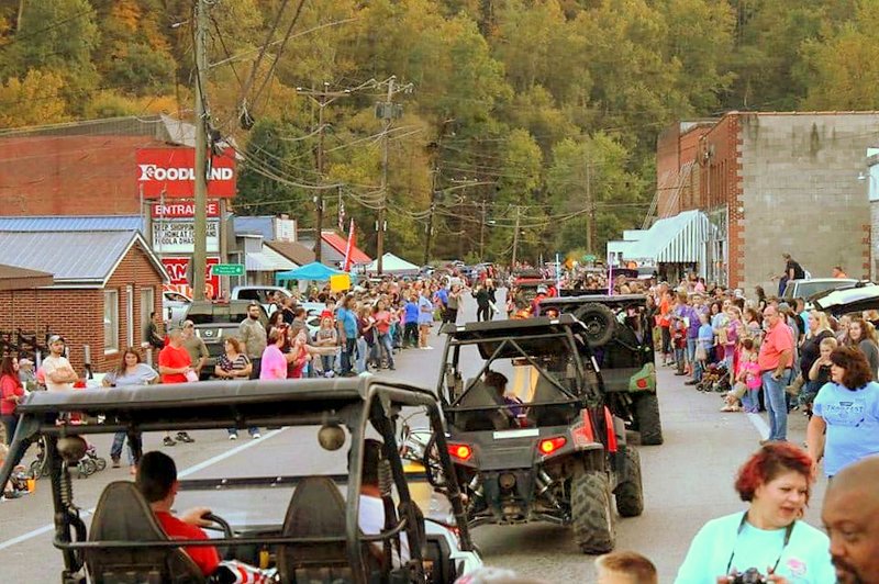 ATVs parade through Gilbert, West Virginia, during National Trailfest.