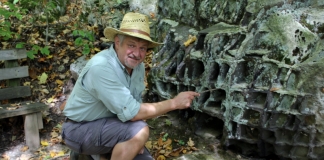 David Sibray explores boulders along the Honeycomb Rocks Trail in Pocahontas County, near Marlinton, West Virginia.