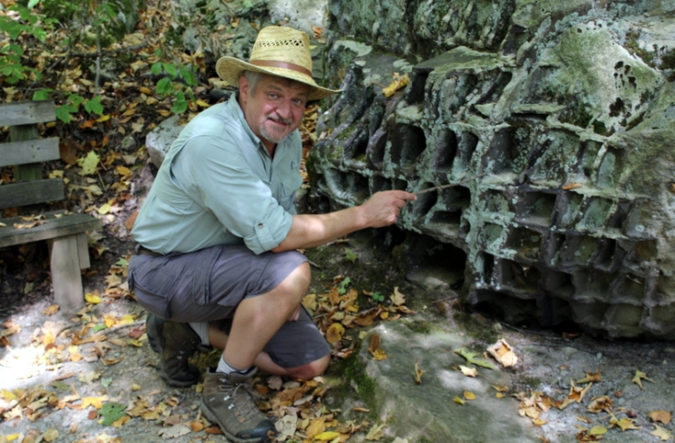 David Sibray explores boulders along the Honeycomb Rocks Trail in Pocahontas County, near Marlinton, West Virginia.