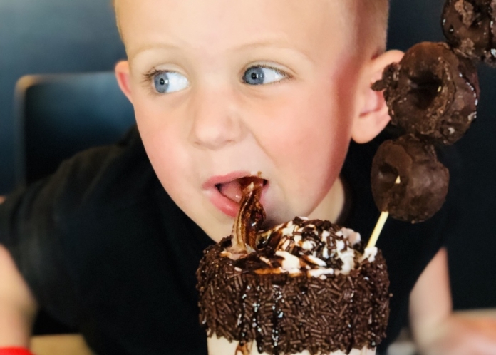A youth tries an I Scream Sundae A youth tries an I Scream Sundae at Ripley, West Virginia.