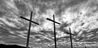 Three crosses rise along a West Virginia ridge.