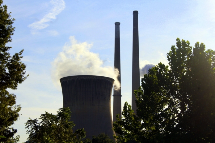 Willow Island Power Station Vapor wafts off a cooling tower at the Willow Island Power Station near Belmont, West Virginia.