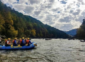 A raft launches into the Gauley River during an exciting excursion with River Expeditions.