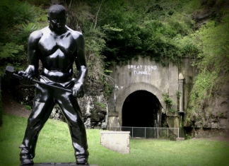 A statue of folk hero John Henry stands outside the Big Bend Tunnel.