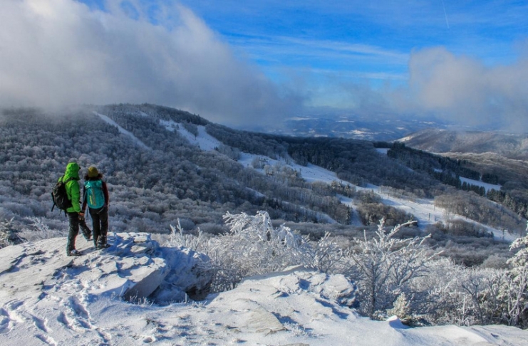 Hikers on Bald Knob survey they ski area at Canaan Valley Resort State Park.