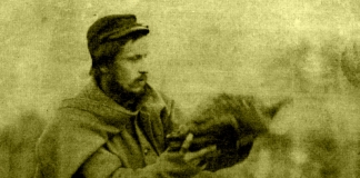 Union soldier Larkin Goldsmith Mead holds a Thanksgiving turkey at Camp Griffin, Virginia, c. 1861.