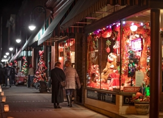 Visitors tour a line of decorated shops during the Bramwell Christmas Tour of Homes. (Photo: Mercer County CVB)