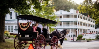 A horse-drawn carriage tours the historic ground of Capon Springs Resort.
