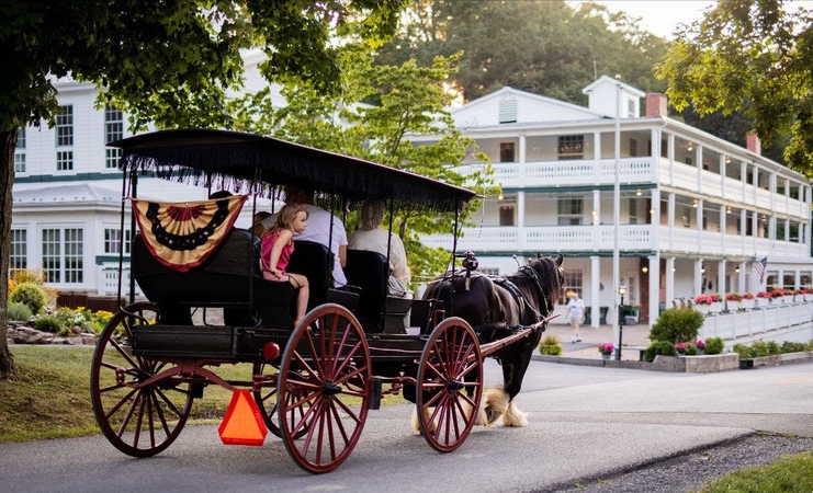 A horse-drawn carriage tours the historic ground of Capon Springs Resort.
