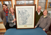 Dr. James Broomall and Monica Lingenfelter flank a map with Bill and Bonnie Stubblefield.