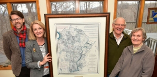 Dr. James Broomall and Monica Lingenfelter flank a map with Bill and Bonnie Stubblefield.