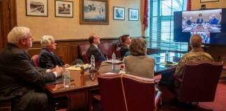 The governor and staff attended a video conference with the President early Monday.