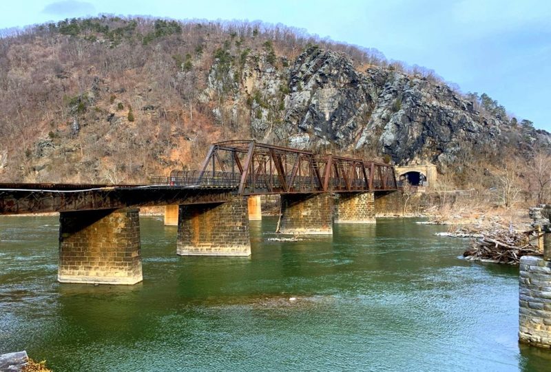 The footbridge over the Potomac at Harpers Ferry was damaged during a derailment (at left). NPS Photo: Autumn Cook