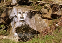 A six-foot-tall face carved by an eccentric sculptor in a cliff near Ripley, WV, is attracting more attention.