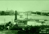 The Nina Paden docks at Belpre, Ohio. Parkersburg, with its tall courthouse tower, lines the Ohio River in the background.