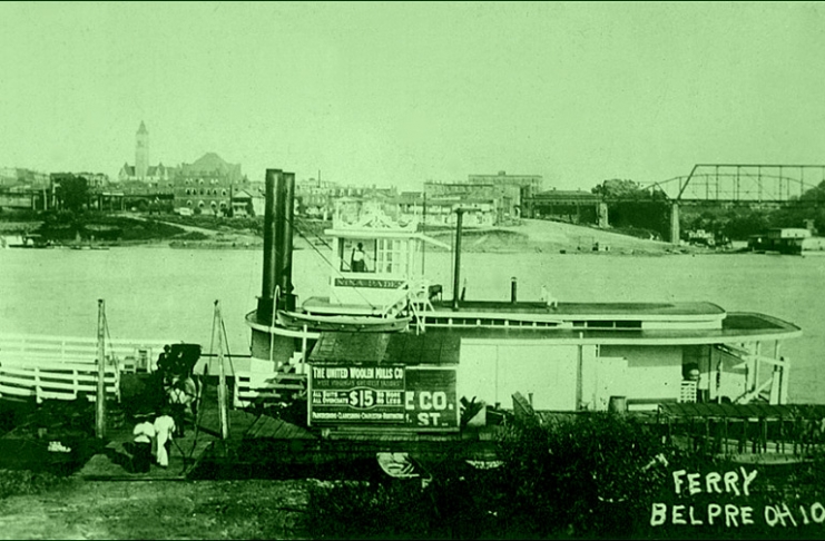 The Nina Paden docks at Belpre, Ohio. Parkersburg, with its tall courthouse tower, lines the Ohio River in the background.