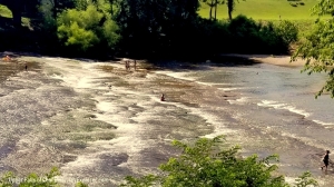 Waders cool off in summer in the upper falls of the Coal River.