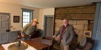 Sibray (left) and Burdette explore stonework and hewn timbers in one of the tavern rooms.