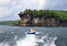 Lilly Bias and a friend ride an innertube on Summersville Lake in south-central West Virginia.