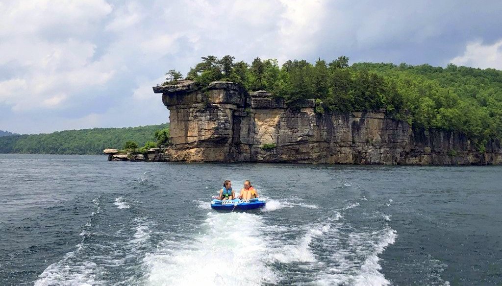 Lilly Bias and a friend ride an innertube on Summersville Lake in south-central West Virginia.