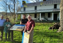 Installing the new signboard from left to right are David Sibray, Becky Sullivan, Dr. Scott Keffer, and Randy Burdette.
