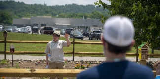 State partners with Toyota to promote pollinator conservation Rachel Rosenberg, a partner biologist with W.Va. Division of Natural Resources and Natural Resources Conservation Service, demonstrates planting techniques.