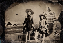 Two young girls pose for a vintage tintype portrait.