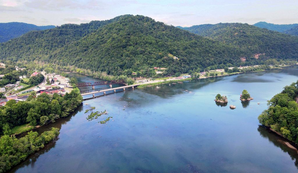 The Town of Gauley Bridge, at left, straddles the mouth of the Gauley River.