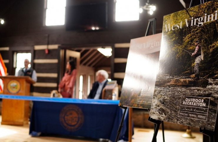 West Virginia officials unveiled collectible travel guides at the lodge at Hawks Nest State Park.