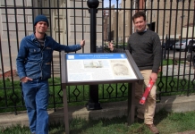 Chris Brown (left) and Drew Gruber (right) pose with the completed sign at Independence Hall.