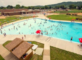 Visitors cavort in the wave pool at the Waves of Fun waterpark at Hurricane, West Virginia.