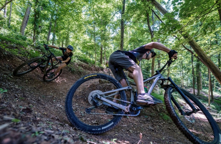 Tracy Toler and his daughter bike a forest trail in southern West Virginia.