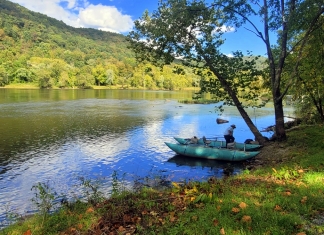 Fishing guide Bill Handy prepares to launch onto the upper New River on an early fall day.