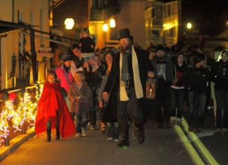 Visitors walk Potomac Street during Christmas in Harpers Ferry, West Virginia.