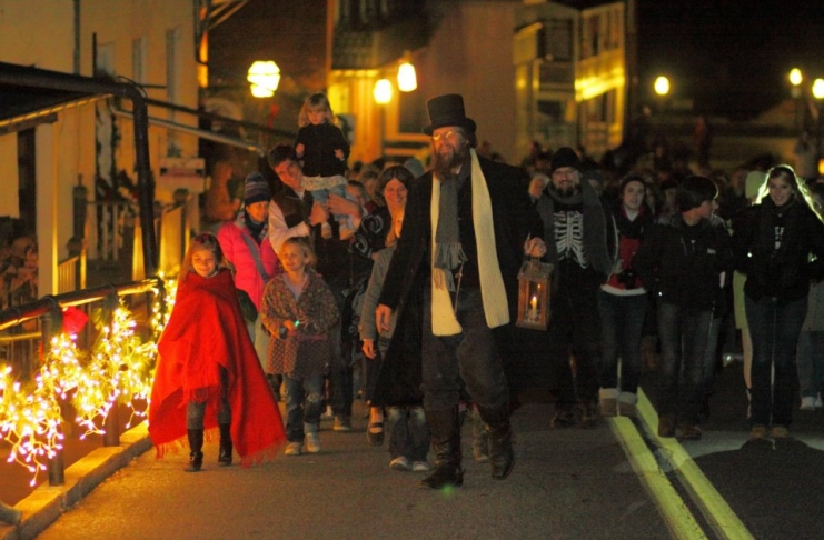 Visitors walk Potomac Street during Christmas in Harpers Ferry, West Virginia.