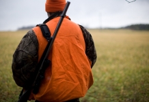 A hunter wanders out into fields in West Virginia.