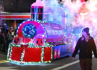 The Toys-for-Tots Train steams through the streets of Ripley during its annual Christmas parade.