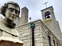 A statue of Saint Anthony of Padua stands outside Saint Anthony's Shrine at Boomer, West Virginia .