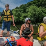 Paul Breuer guides whitewater raft
