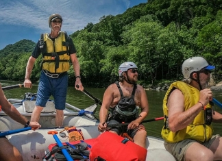 Paul Breuer guides a whitewater raft through the New River Gorge