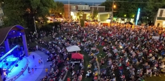 Crowds gather at a community concert in downtown Oak Hill.