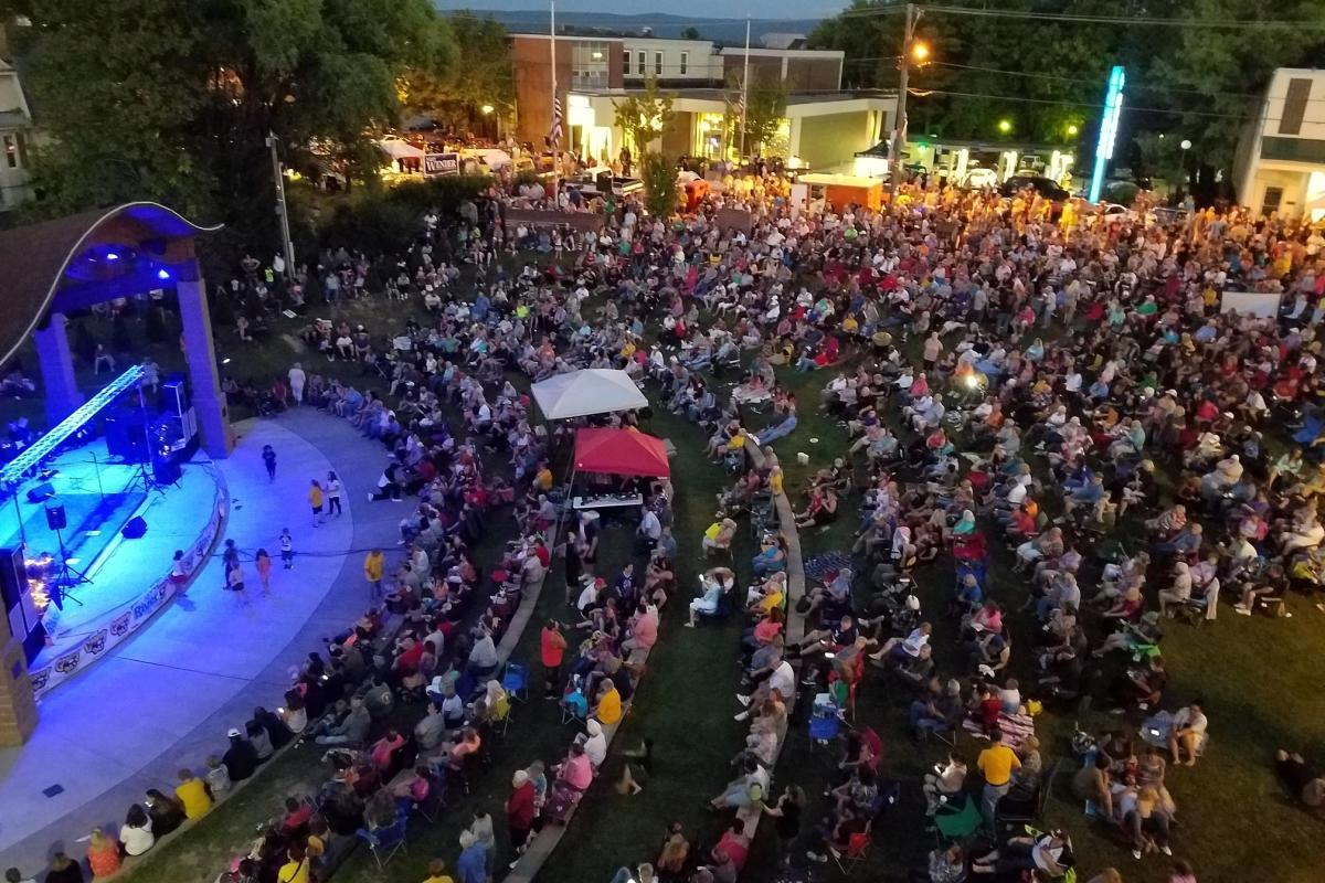 Crowds gather at a community concert in downtown Oak Hill.